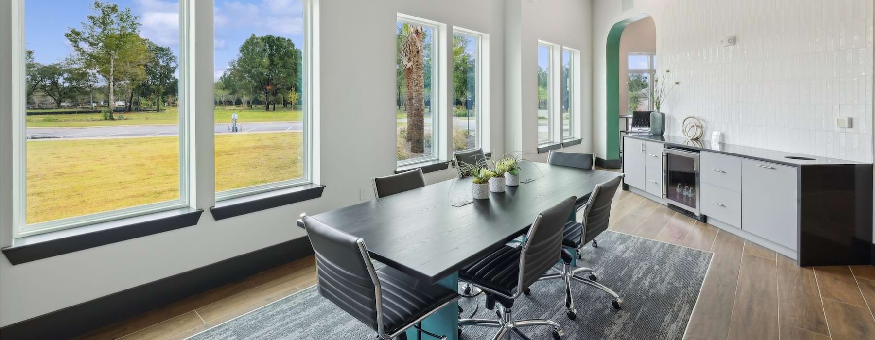 a private clubroom with a table and chairs
